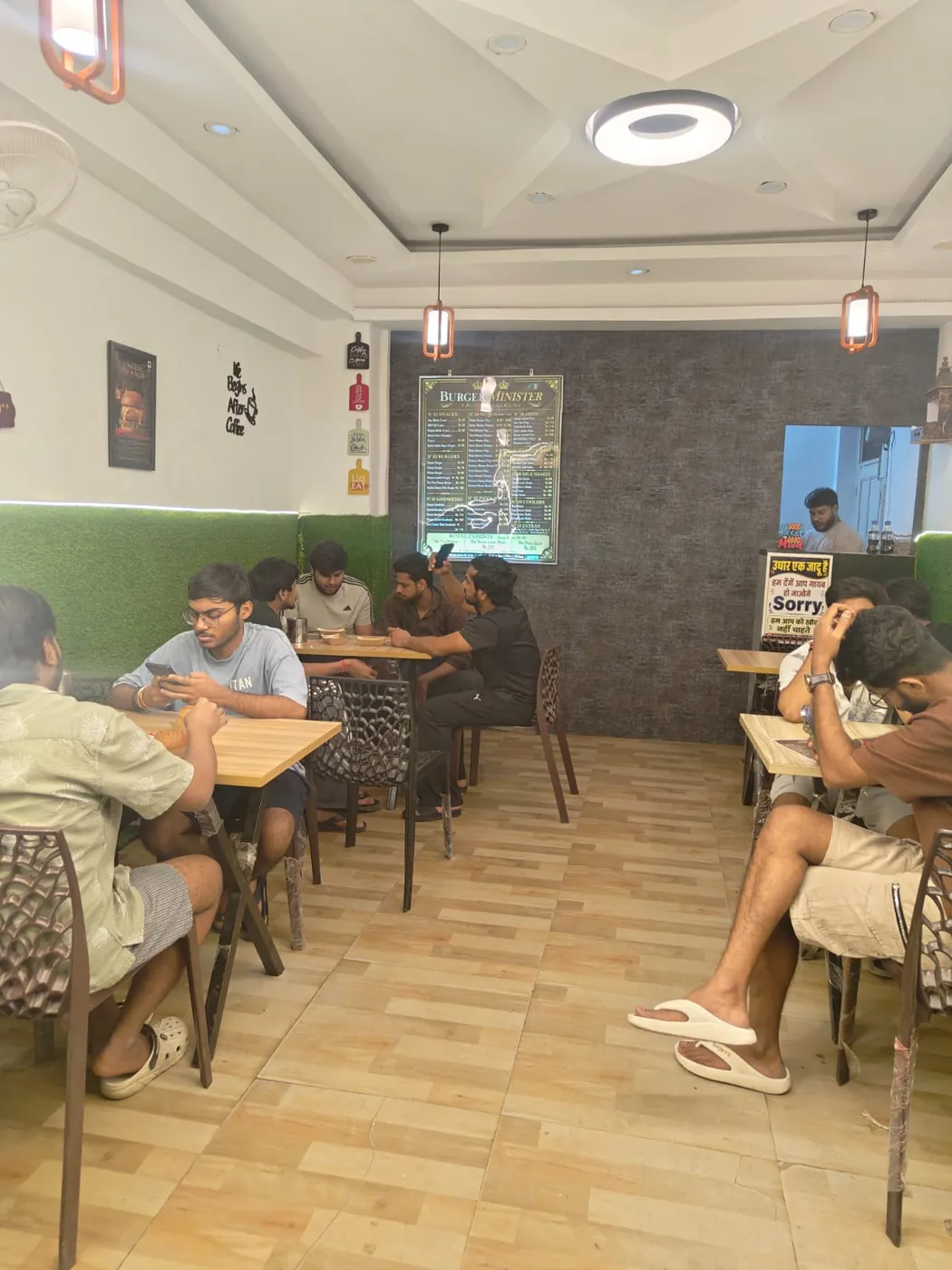 Clean dine-in seating area at Burger Minister, Sector 58 Noida