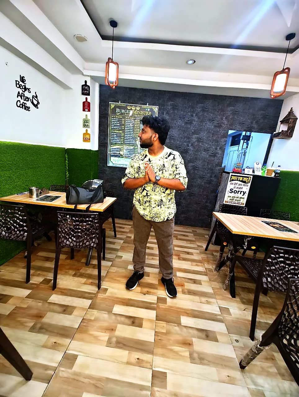 Burger Minister staff welcoming guests to the pure veg cafe, Sector 58 Noida
